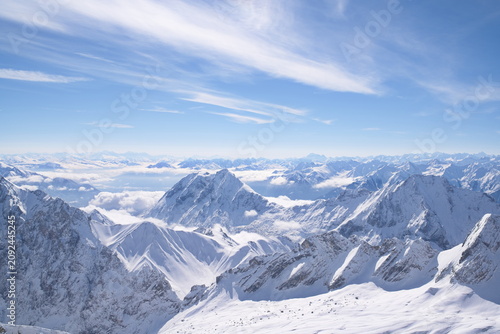 Dramatic Alpine Landscape with Layered Mountain Ridges and Clouds
