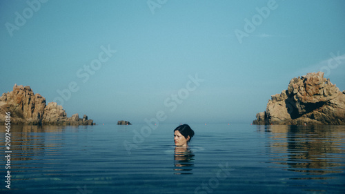 woman swimming on the beach in Sardinia