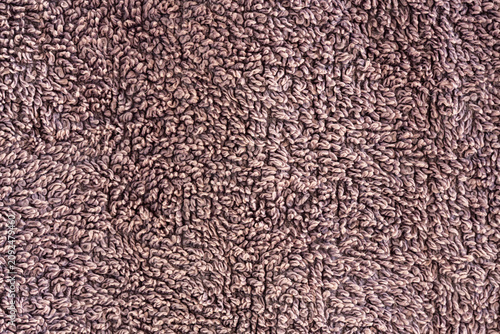 Close-up of brown terry cloth towel texture background