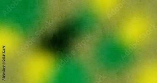 Abstract soft focus green and yellow bokeh background with watercolor texture overlay. Smooth blurry gradient backdrop for banner