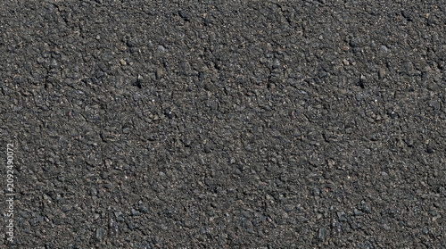 Dark rough asphalt road texture background