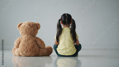 Lonely Child Sitting Beside Teddy Bear Symbolizing Childhood Loneliness and Emotional Wellbeing