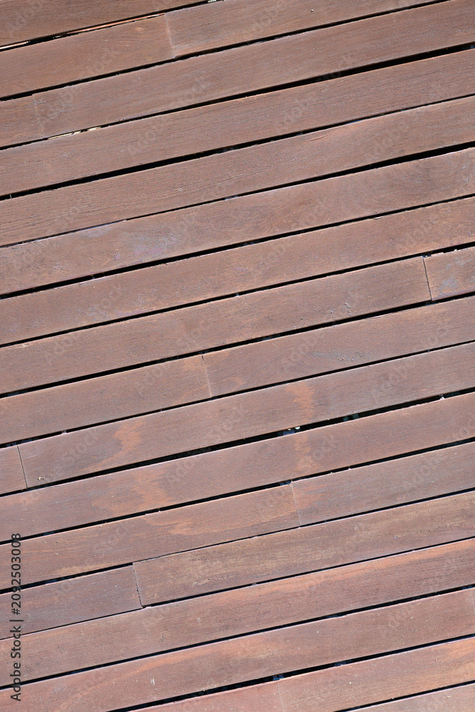 Obraz premium Close-up of the wooden slats of a pedestrian walkway.
