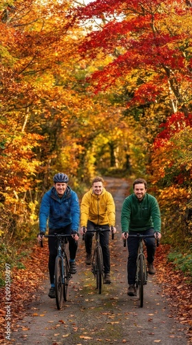 Three friends cycling through colorful autumn forest.