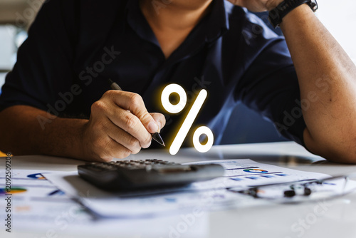 Business Professional Reviewing Financial Reports with Percentage Rate Concept