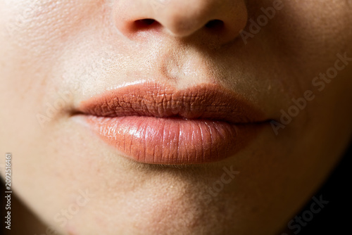 Bild auf Leinwand Warm Terracotta Lipstick: Luxury Cosmetics Close-Up with Satin Finish and Subtle