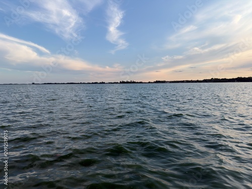 Serene Lake with Wispy Clouds in Evening Light