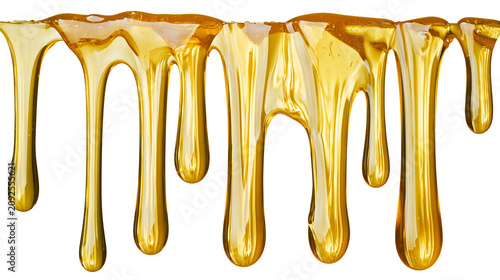 Slika na platnu Golden honey dripping in viscous strands, isolated on transparent background