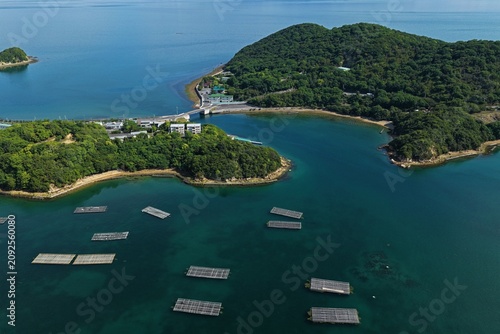 Photography Aerial drone photo of oyster rafts and island coastline in Mushiake, Setouchi, J