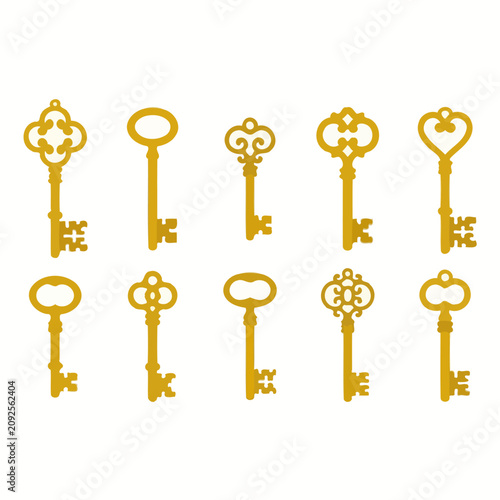 A collection of ten vintage golden keys on white background