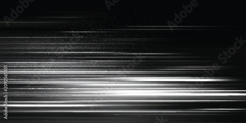 Cuadro en lienzo Abstract blurry white light streaks on dark background with particles moving fas