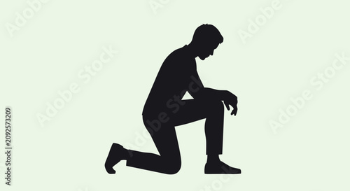 Tableau sur toile Silhouette of man kneeling in prayer, humble pose, seeking divine guidance and solace