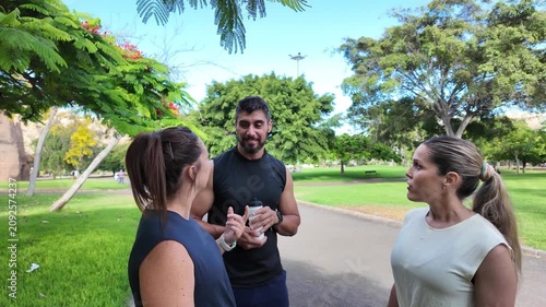 A group of friends chatting happily in the park