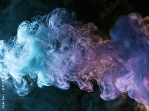 Color smoke swirls through the air creating a mist texture and a spiritual aura in a dark setting during the night