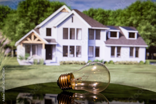 Close up of light bulb with residential house background.