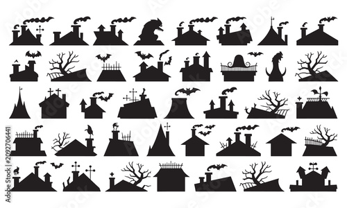 Assorted black silhouettes of haunted house roofs, chimneys, gnarled trees, bats, and spooky architectural isolated on a white background, for halloween themed
