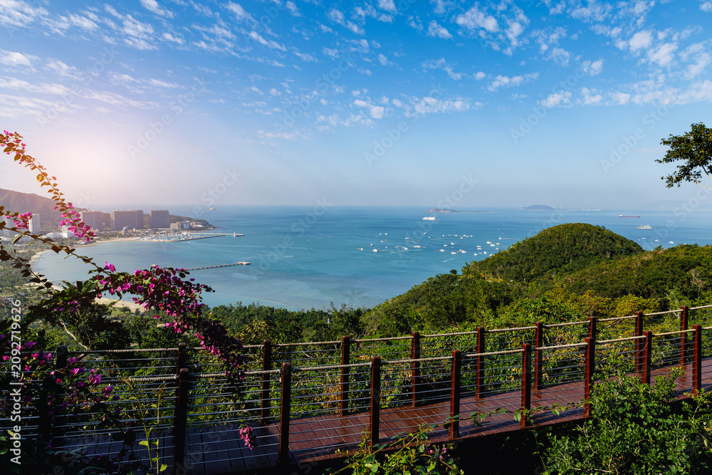 Naklejka premium Aerial view park overlooking harbor and city at Sanya, Hainan Island, China
