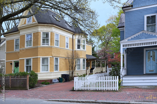 Bild auf Leinwand Neighborhood of pastel colored clapboard houses
