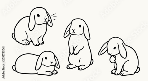Bilde på lerret Set of cute hand drawn lop eared rabbits in various poses on a cream background