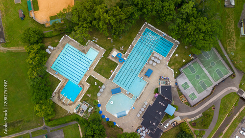 Aerial view presenting outdoor swimming pools and sports courts
