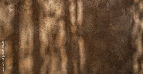 Foto A textured background featuring earthy tones of brown, showcasing soft patterns that create a sense of depth and warmth, ideal for various design applications