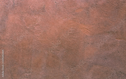 Obraz na plátně A close-up view of a textured surface with a warm brown hue