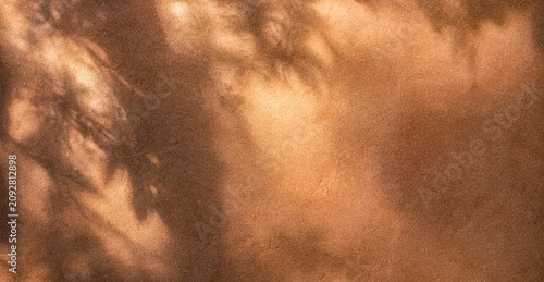 Foto Abstract brown background featuring soft shadows and light patterns, creating a warm, organic feel