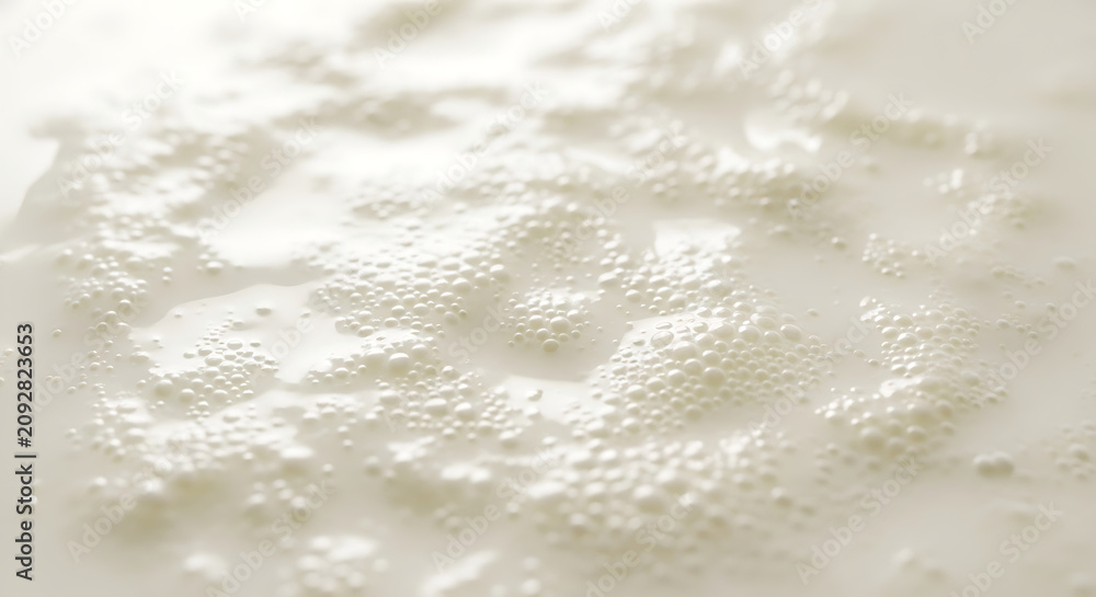 Fototapeta premium Close-up of frothy milk with small bubbles, creating a creamy texture