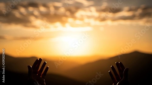 Hands Reaching Towards a Glorious Sunrise Over Mountains, Symbolizing Hope and Spirituality