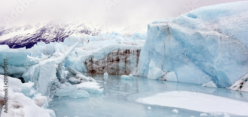 Quadro su tela Massive Blue Ice Formations and Meltwater Pools of the Knik Glacier in the Chuga