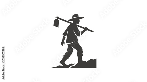 Foto Man walking with shovel on shoulder.