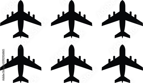 Tableau sur toile Six black silhouettes of airplanes flying away from viewer