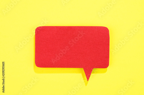 Red speech bubble on yellow background