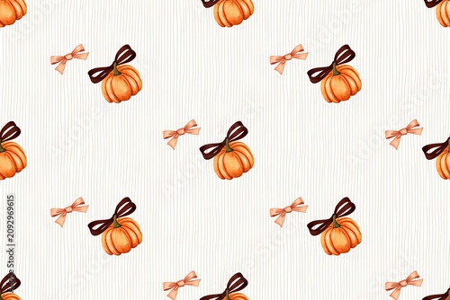 Decorative orange pumpkins with brown ribbons on striped white background