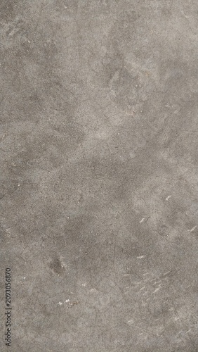 Grunge grey concrete wall texture with fine cracks and scratches