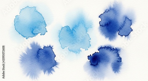 Set of abstract blue watercolor paint splashes on white background.