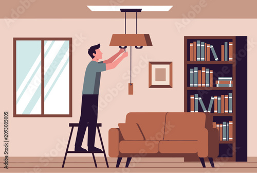 Man standing on a stepladder to repair a ceiling light fixture in a cozy living room with a sofa and bookcase.