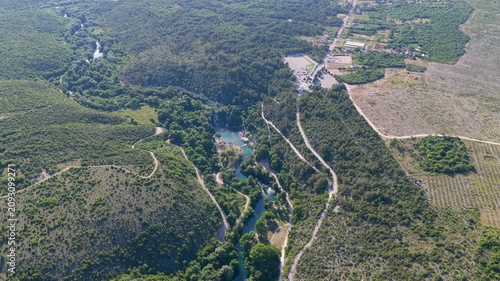 Kravica Waterfall, Bosnia and Herzegovina - June 7, 2026: Distant aerial panorama of the famous Kravica Waterfall and surrounding landscape