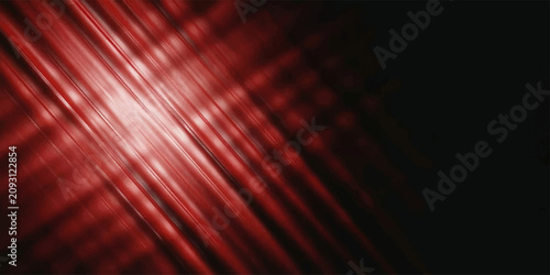 Fotografie Abstract red light streaks on a dark background.
