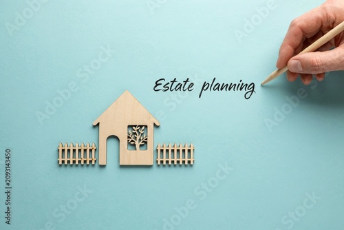 Estate Planning Concept With Wooden House, Handwriting and Copy Space