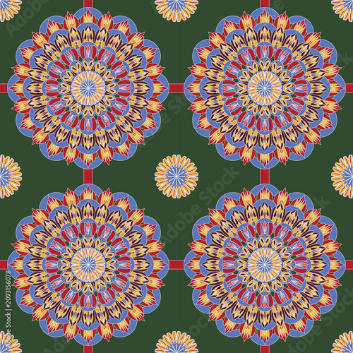Seamless floral mandala with vibrant blue, red, and gold petals on a deep green background. Ideal for textiles, wallpaper, home décor, gift wrap, fashion, and surface pattern design.