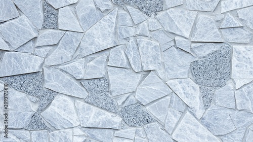 gaps. A textured wall surface composed of broken marble pieces fitted together. real-estate listings, architecture portfolios, designed for real-estate listing and luxury residence showcases.