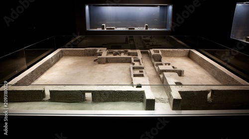 archaeological. Aerial view of a sand table model showing ancient city walls layout. real-estate listings.