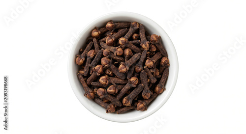 Top view of dried long pepper catkins in a small white ceramic bowl