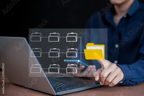 Digital file storage and corporate data organization concept with virtual folder structure graphics.