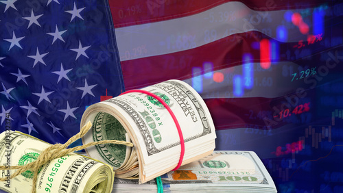 Bild auf Leinwand Bar charts, financial data tables, rolls of US dollar bills, and the United States flag