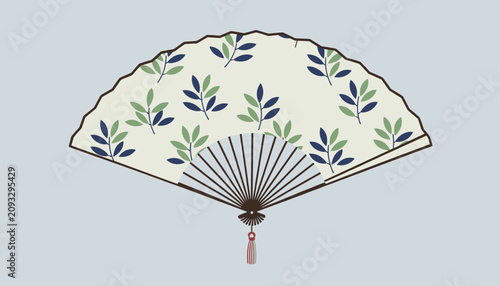 Traditional folding hand fan with a beautiful pattern of blue and green leaves on a light grey background.