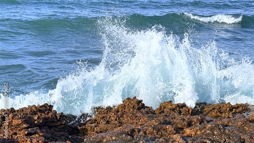 Ocean waves crashing on rocky coastline