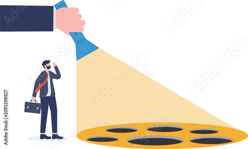 Hand using flashlight to reveal trap on ground