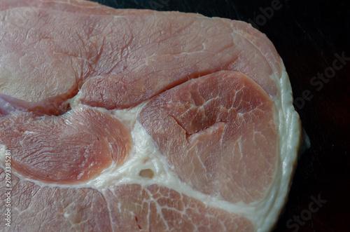 Raw pork loin with visible fat marbling and tender texture